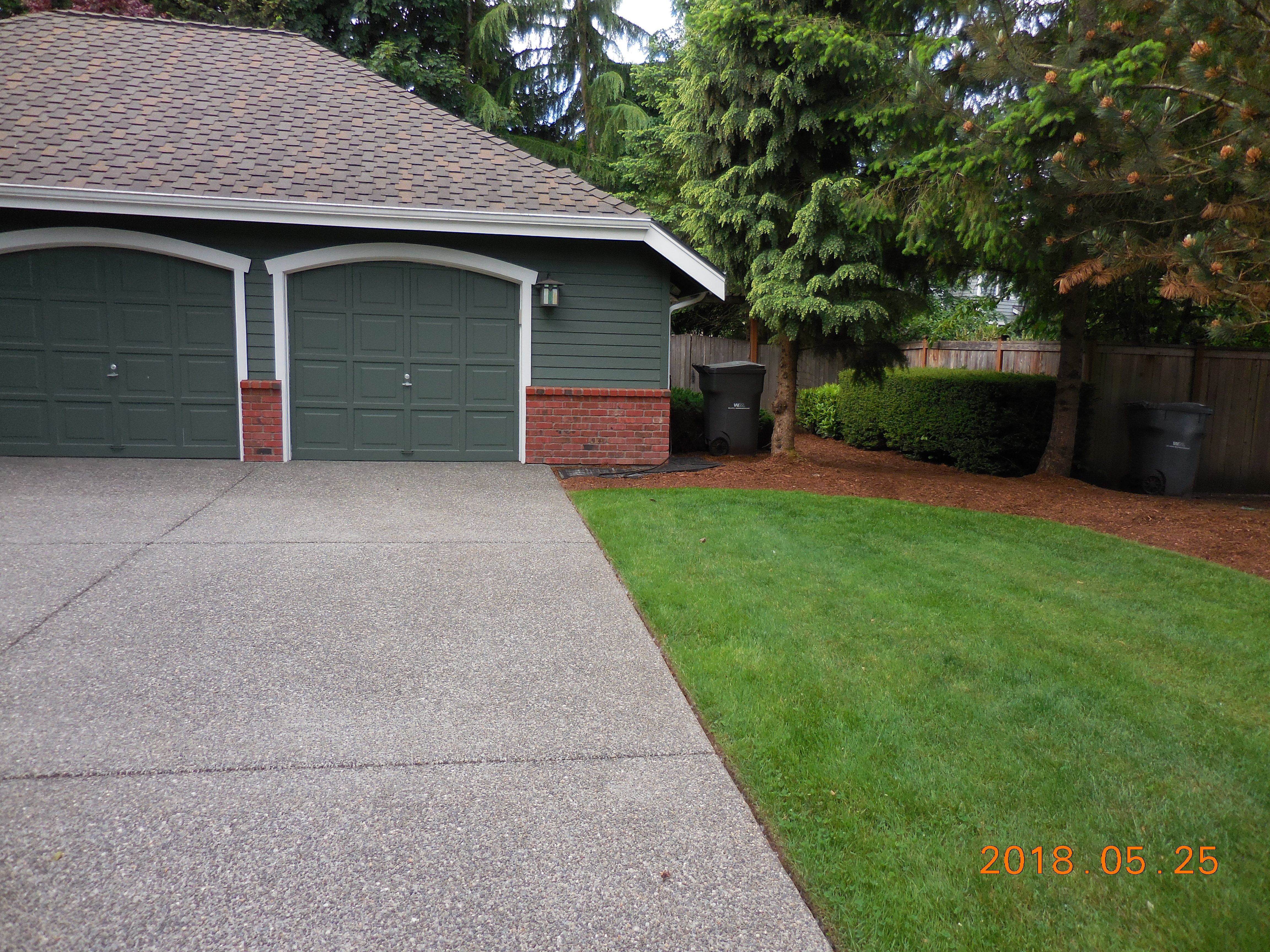 Where I park the RAV4 EV.  The tree on the corner has since been removed, as it was fouling the garage's foundation.