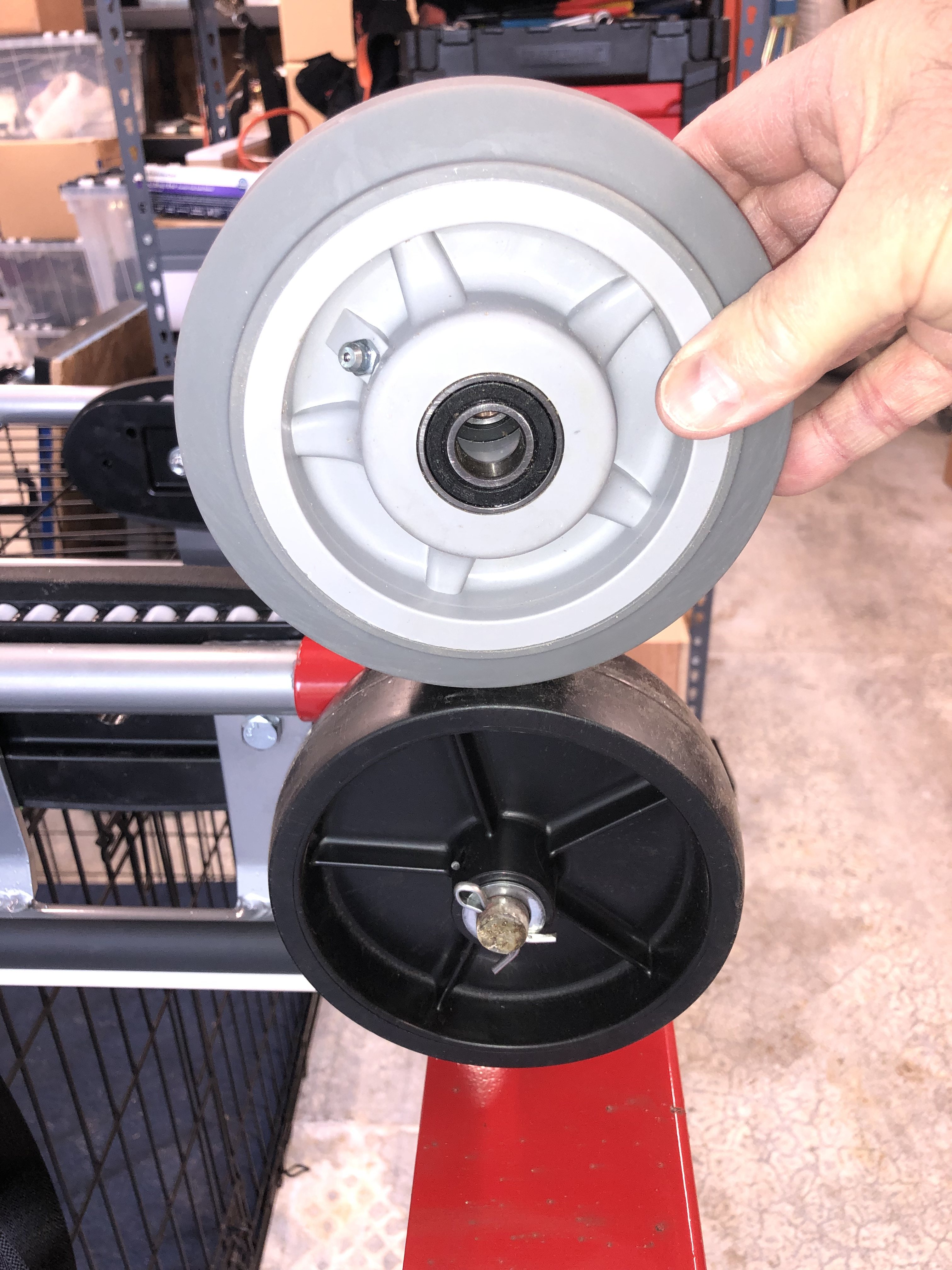 OEM Milwaukee wheel, and replacement ball-bearing wheel.