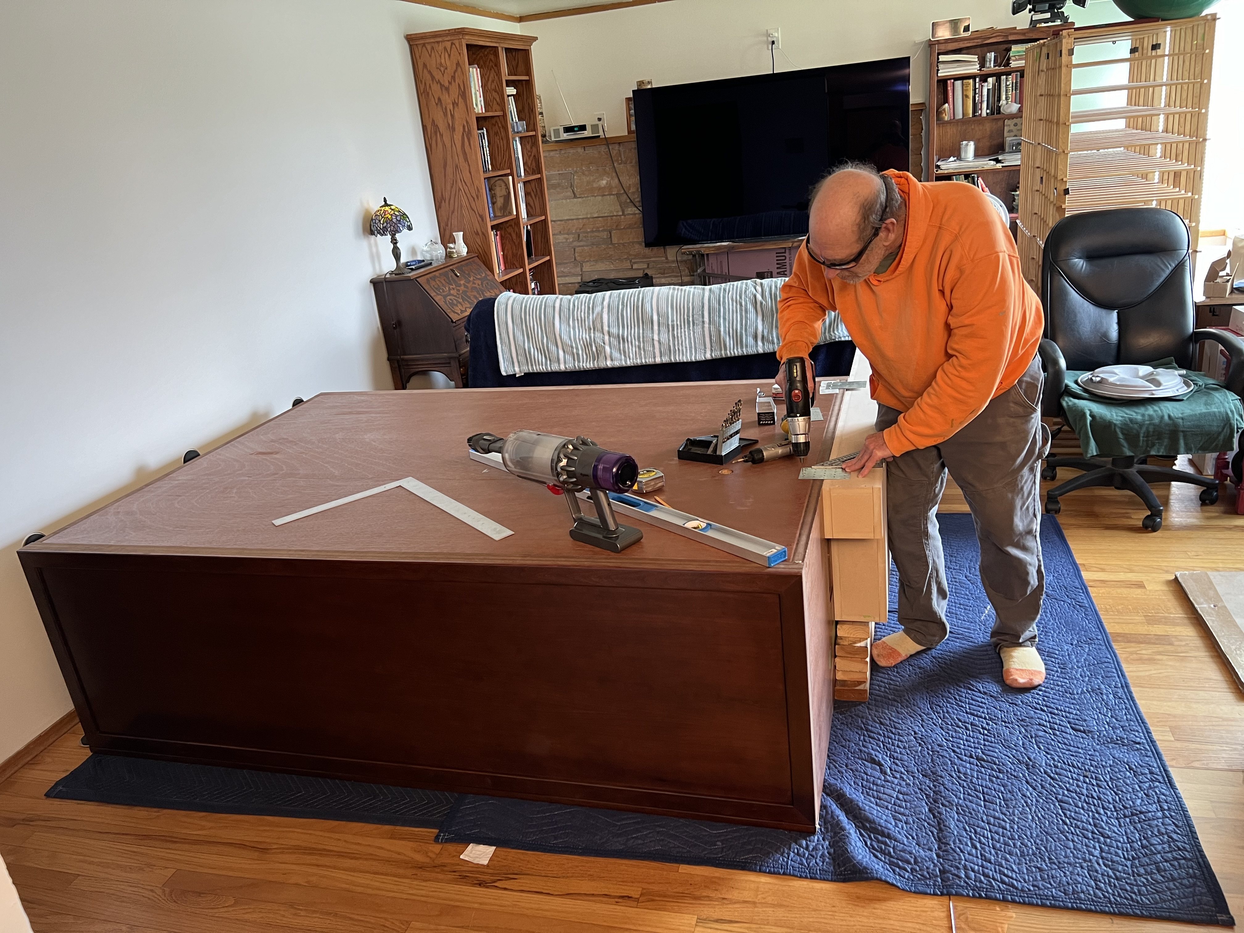 Pre-assembling the unpainted duct to the cabinet top.  We won't be able to pilot bracket holes with the cabinet upright, so this is the step where the pilot holes are created in the right places.