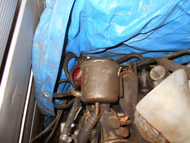 1. a. The reservoirs mount location, using bolts of the engine sling-hook bracket