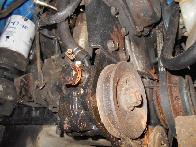 6. Power Steering pump, pressure hose mount, and return line location.