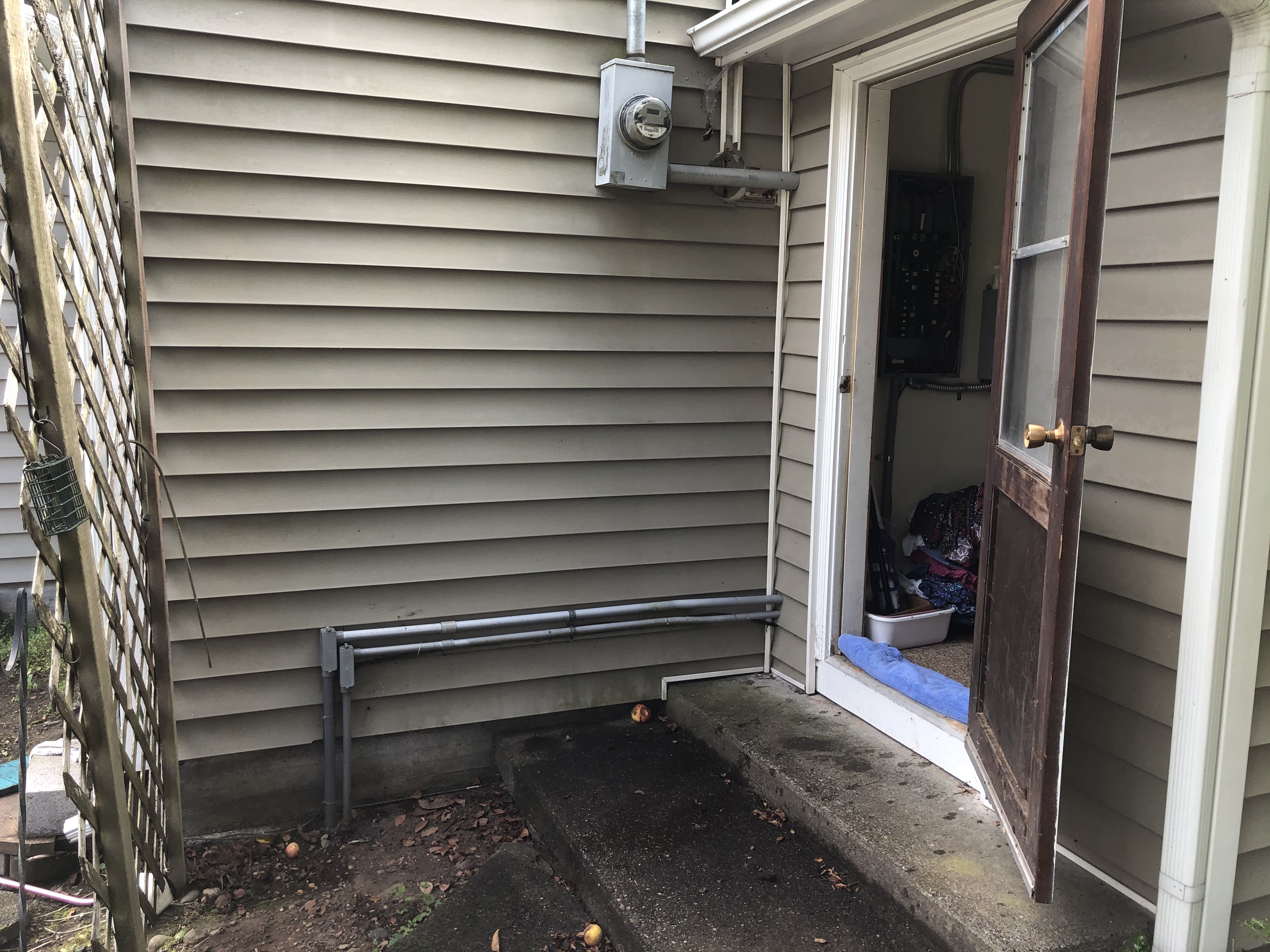 House breaker panel conduit to outside and into ground
