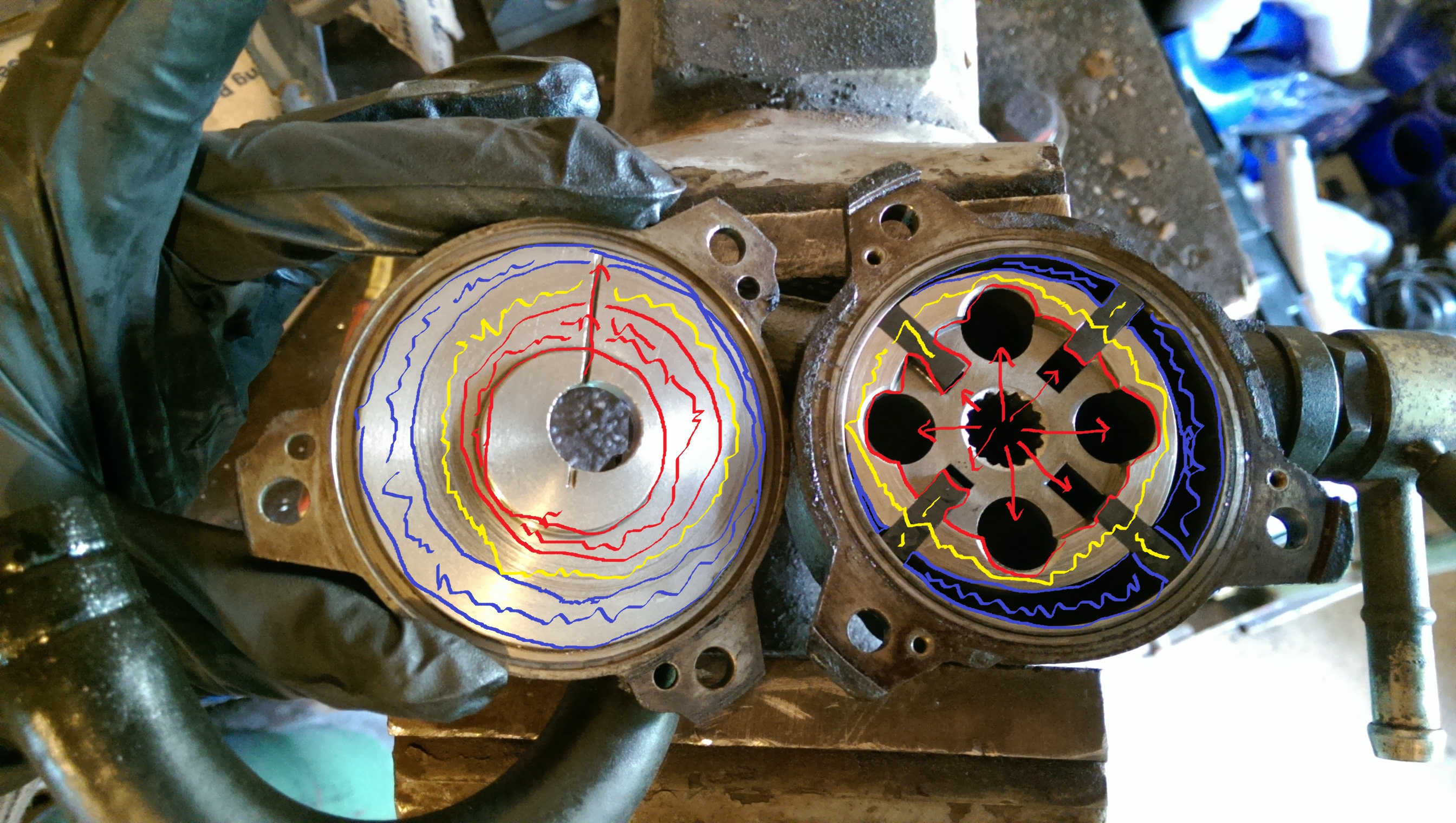 i drew this badly on paint program. the red area is incoming oil pressure from the engine. acting inside the rotor assembly and the vanes itself pushing the vanes harder on the outer housing. the yellow area is the acting surface which creates the seal for vacuum once there is small amount of oil seeping around the rotor assembly. the blue area is where the vacuum is created and the exhausted oil is drained from